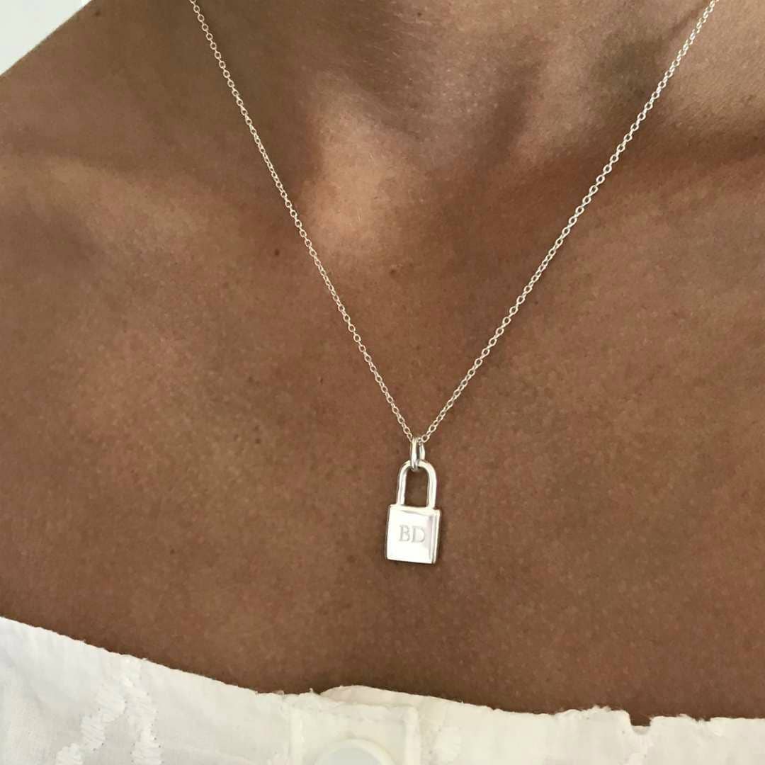 wearing padlock necklace with initial BD engraved
