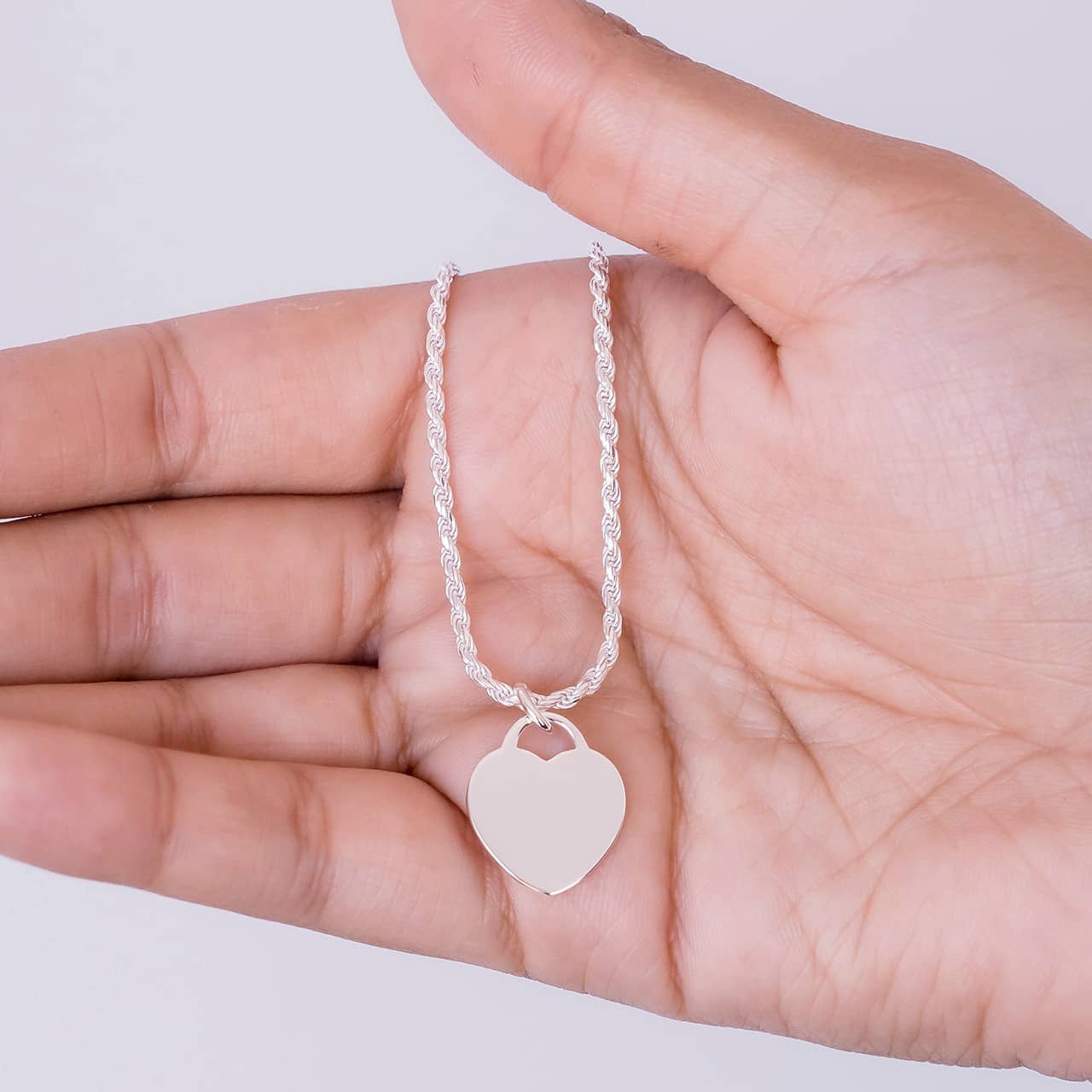 Silver heart tag pendant and rope bracelet